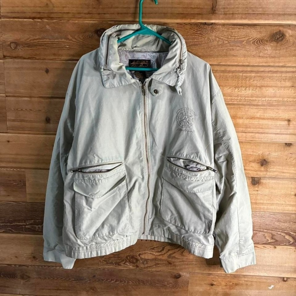 Vintage Eddie Bauer cream windbreaker jacket with hood and pockets